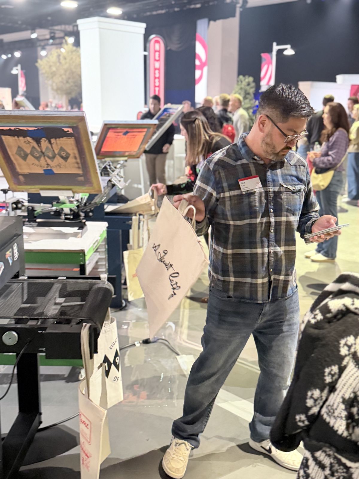 Merch Troop live printing — presses rolling at the event